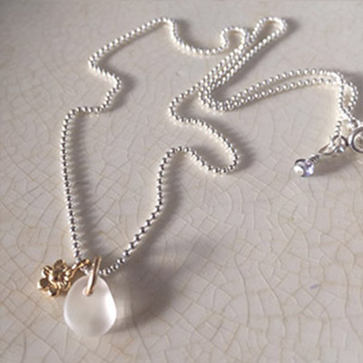 Delicate seaglass droplet & tiny gold flower on silver chain